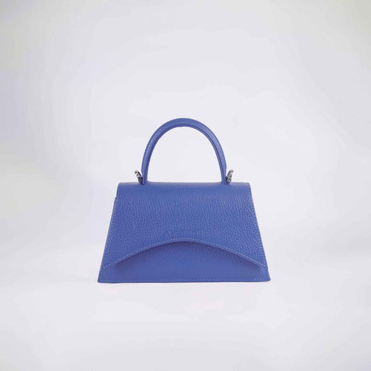 A blue textured handbag with a structured handle and a detachable strap, displayed against a white background.